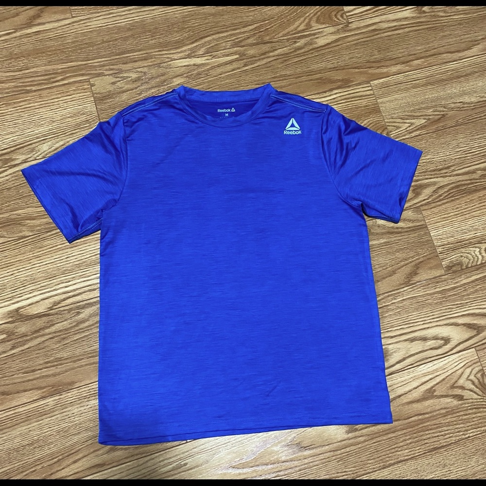 Last Chance…..Before Donating Reebok men’s size medium blue workout shirt